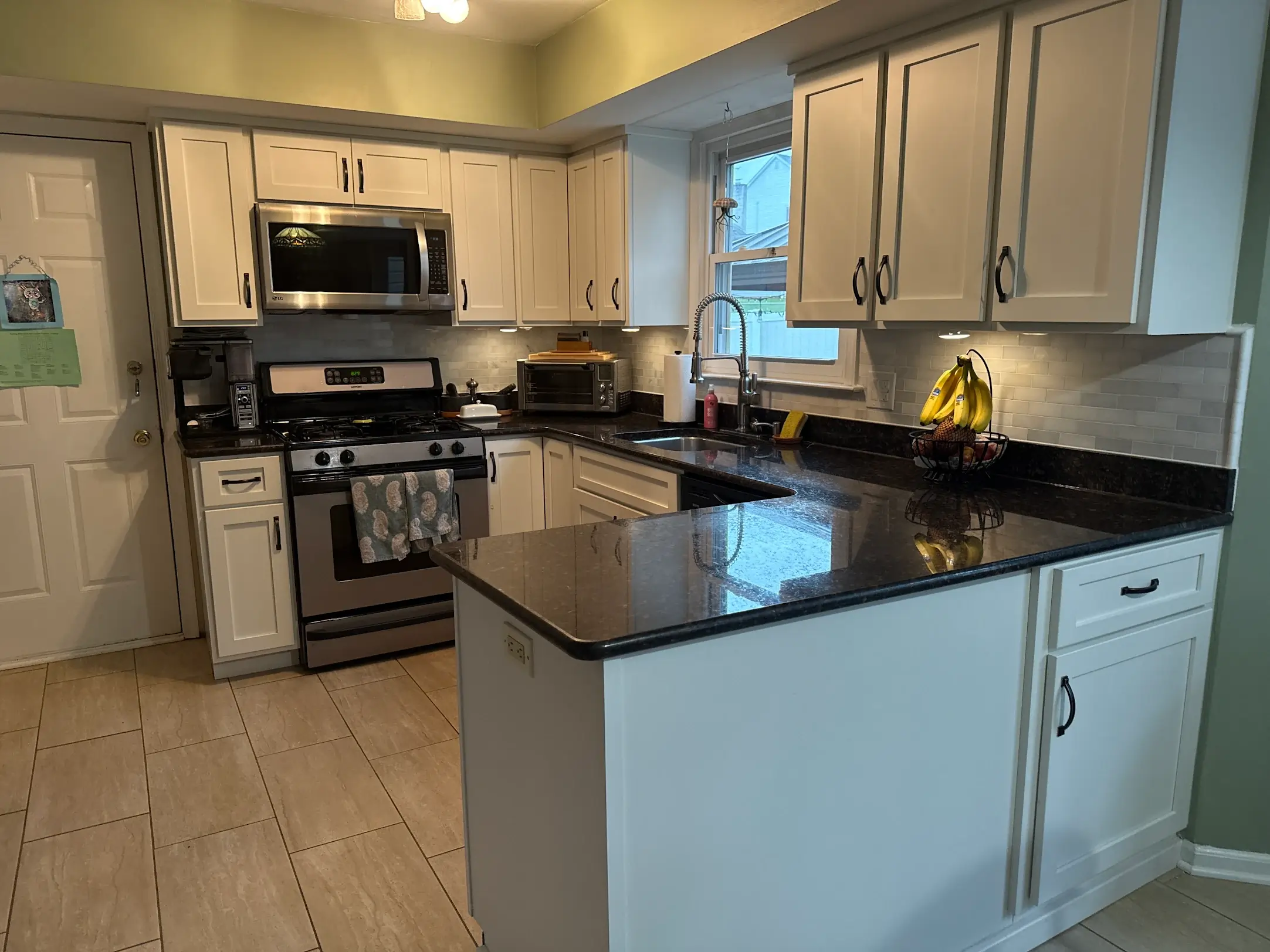 Modern kitchen with granite countertops.