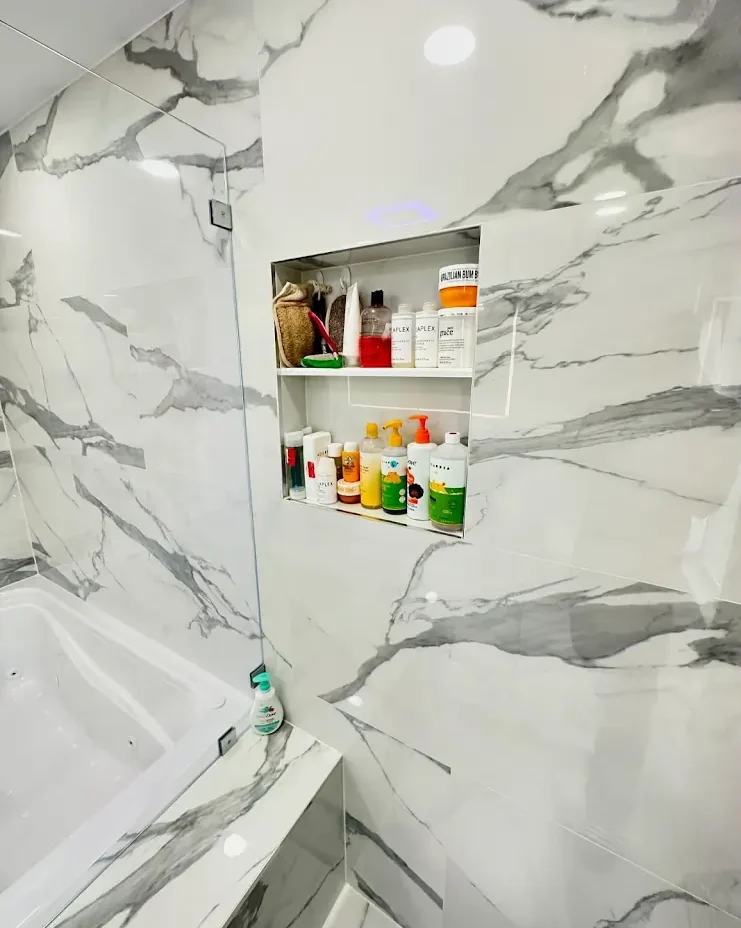 Modern bathroom with organized shelf products.